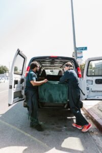 Bulky waste collection team in Dubai loading furniture into a van