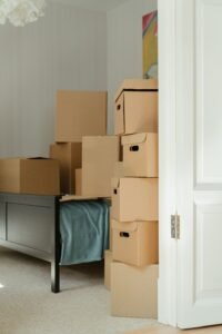 Residential junk removal in Dubai clearing stacked boxes and household items from a home