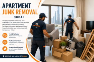 Workers moving a wrapped mattress into a padded service lift during an apartment junk removal in a Dubai tower